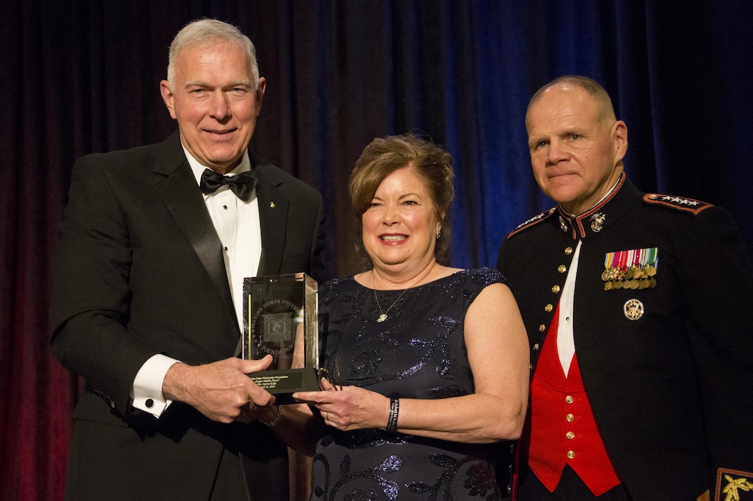 From left, retired U.S. Marine Gen. James T. Conway, the 34th Commandant of the Marine Corps (CMC), Mrs. Karen Kelly, wife of retired Marine Gen. John F. Kelly, and CMC Gen. Robert B. Neller pose for a photo during the Semper Fidelis Award ceremony at Washington, D.C., March 12, 2016. The Marine Corps University Foundation presented the Semper Fidelis award to both Kellys. (U.S. Marine Corps photo by Staff Sgt. Gabriela Garcia/Released)
