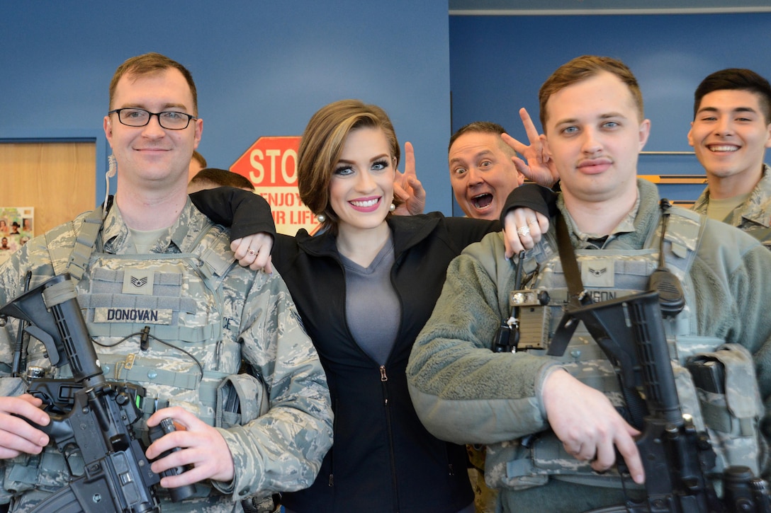 Betty Cantrell, center, Miss America 2016, and airmen pose for a photograph during the USO spring tour on Joint Base Elmendorf-Richardson, Alaska, March 12, 2016. Air Force photo by Airman 1st Class Christopher R. Morales