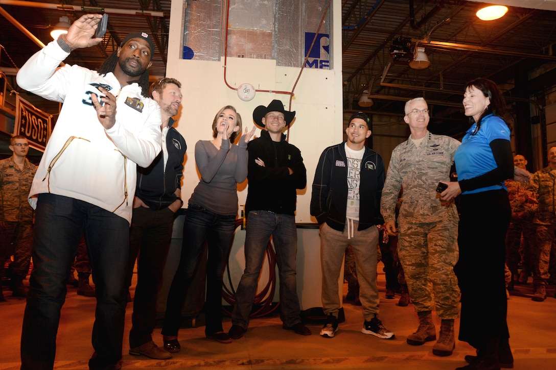 Air Force Gen. Paul J. Selva, second from right, vice chairman of the Joint Chiefs of Staff, and members of the USO spring tour pose for a photograph on Joint Base Elmendorf-Richardson, Alaska, March 12, 2016. From left, tour members include: Panthers football player Charles Tillman; country singer and 10-year Army veteran Craig Morgan; Miss America 2016 Betty Cantrell; and Ultimate Fighting Championship fighters Donald ‘Cowboy’ Cerrone and Anthony Pettis. Air Force photo by Airman 1st Class Christopher R. Morales