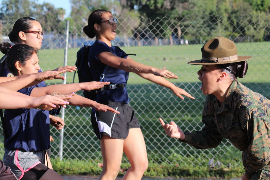 Drill Instructor Staff Sgt. Kayla Cerda commands poolees pf Recruiting Stations Los Angeles and Orange County to run in the place during a female pool function at the Sherman Oaks Recreation Park in Van Nuys, Calif., March 12, 2016. (U.S. Marine Corps photo by Staff Sgt. Alicia R. Leaders/Released)