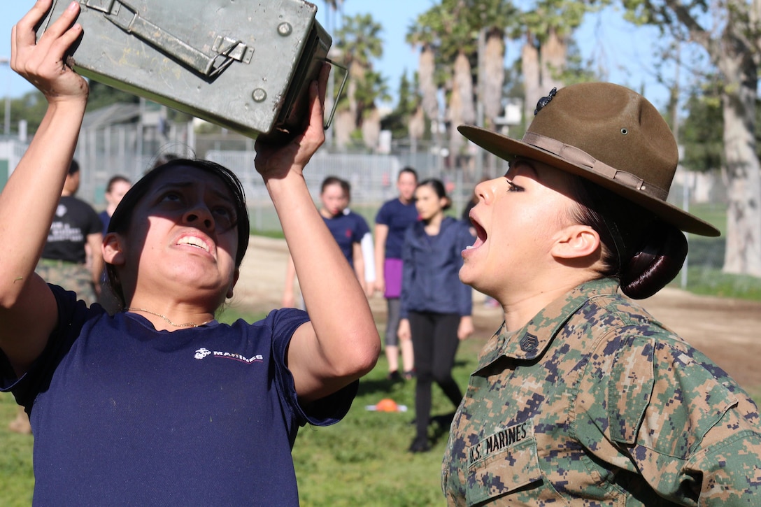 Drill Instructor Staff Sgt. Kayla Cerda yells at a poolee to conduct ammo-can lifts during a female pool function for Recruiting Stations Los Angeles and Orange County at the Sherman Oaks Recreation Park in Van Nuys, Calif., March 12, 2016. (U.S. Marine Corps photo by Staff Sgt. Alicia R. Leaders/Released)