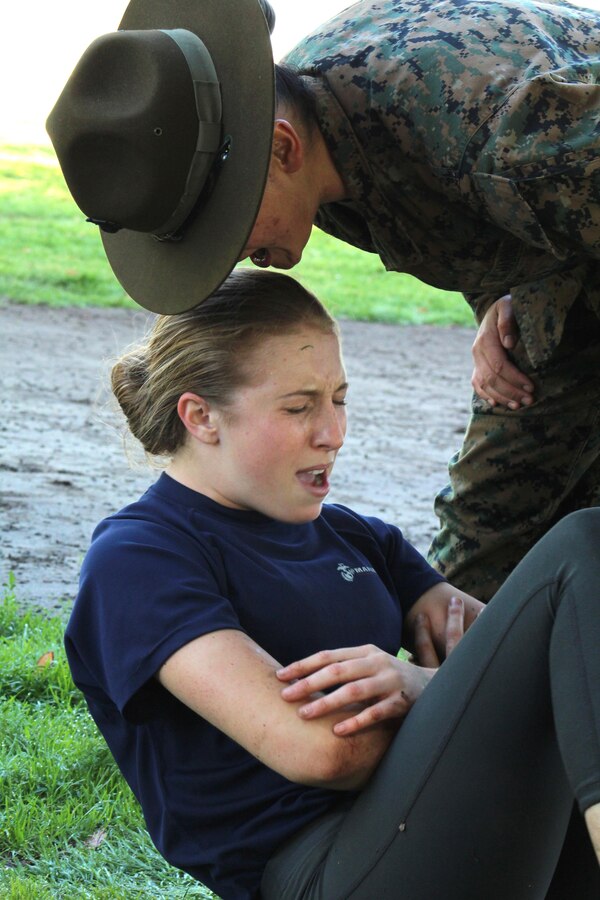 Drill Instructor Staff Sgt. Adrianna Medina commands Alexandria Banks, a poolee from Recruiting Sub Station Santa Clarita of Recruiting Station Los Angeles, to conduct crunches during a female pool function at the Sherman Oaks Recreation Park in Van Nuys, Calif., March 12, 2016. (U.S. Marine Corps photo by Staff Sgt. Alicia R. Leaders/Released)