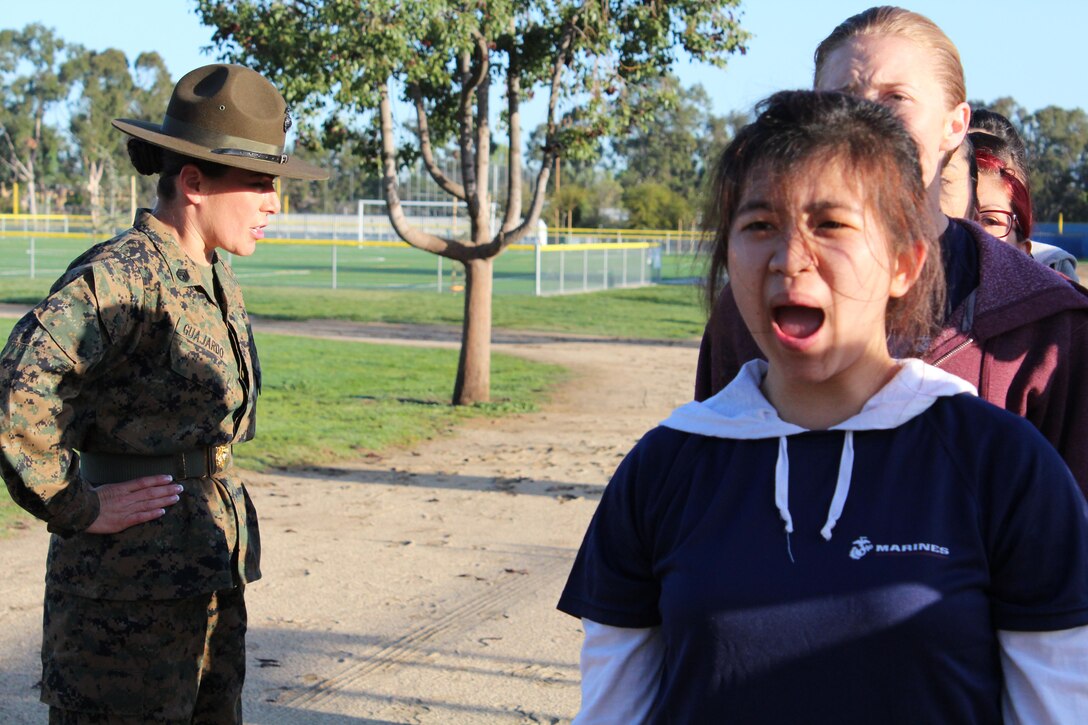 Poolees from Marine Corps Recruiting Station Los Angeles respond to a command from Drill Instructor Staff Sgt. Karin Guajardo, as she forms the poolees into formation during a female pool function at the Sherman Oaks Recreation Park in Van Nuys, Calif., March 12, 2016. (U.S. Marine Corps photo by Staff Sgt. Alicia R. Leaders/Released)