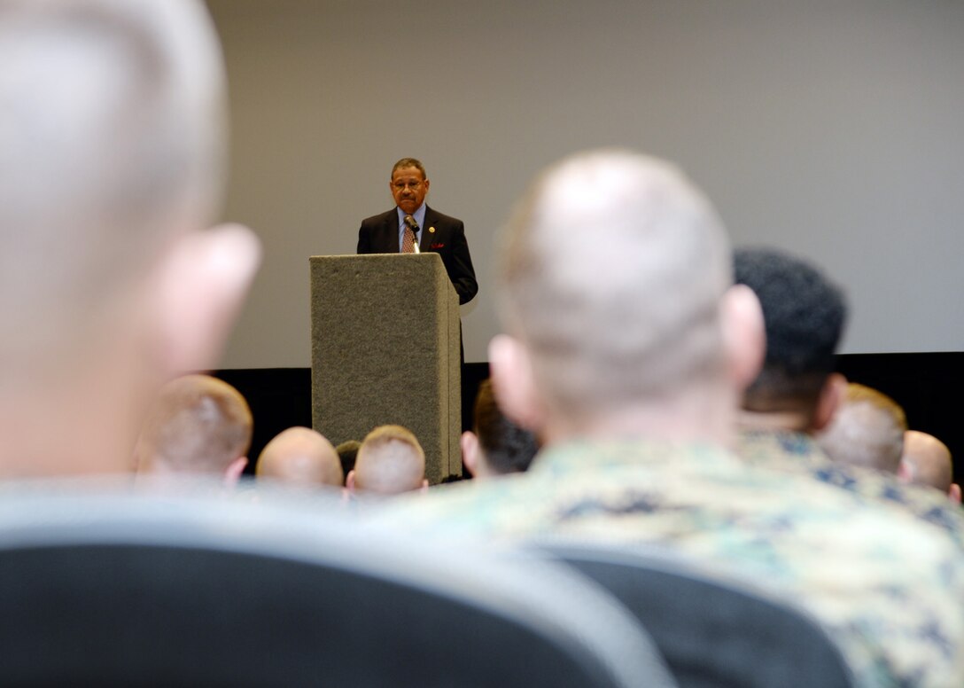 U.S. Rep. Sanford D. Bishop, member of Congress, speaks to Marines and Sailors during a town hall meeting at the Base Theater aboard Marine Corps Logistics Base Albany, March 9.  Bishop serves as co-chair of the Congressional Military Family Caucus and listened to service members as they asked various questions following his remarks about current and past legislation involving pay, health and education benefits, housing and other issues affecting military families.