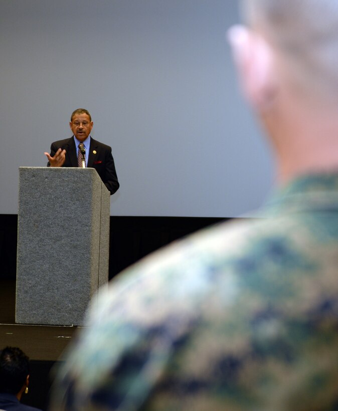 U.S. Rep. Sanford D. Bishop, member of Congress, answers a Marine’s question during a town hall meeting at the Base Theater aboard Marine Corps Logistics Base Albany, March 9.  Bishop, who serves as co-chair of the Congressional Military Family Caucus, answered various questions following his remarks about current and past legislation involving pay, health and education benefits, housing and other issues affecting military families.