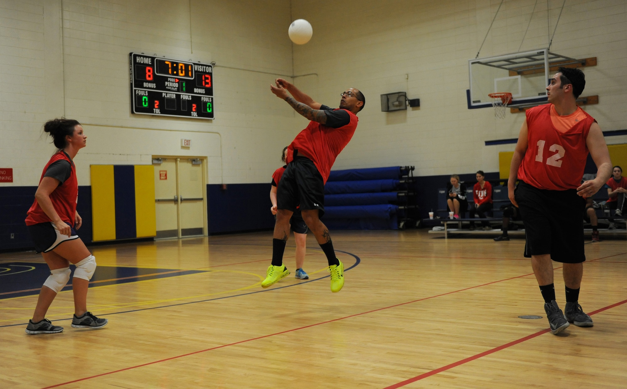 Tech. Sgt. Juan Santana Martinez, 81st Aerospace Medicine Squadron base operation medicine cell  standards NCO in charge, bumps the ball during an intramural volleyball game against the 81st Training Support Squadron at the Blake Fitness Center March 10, 2016, Keesler Air Force Base, Miss. The 81st TRSS defeated the 81st AMDS, 2-1. (U.S. Air Force photo by Kemberly Groue)