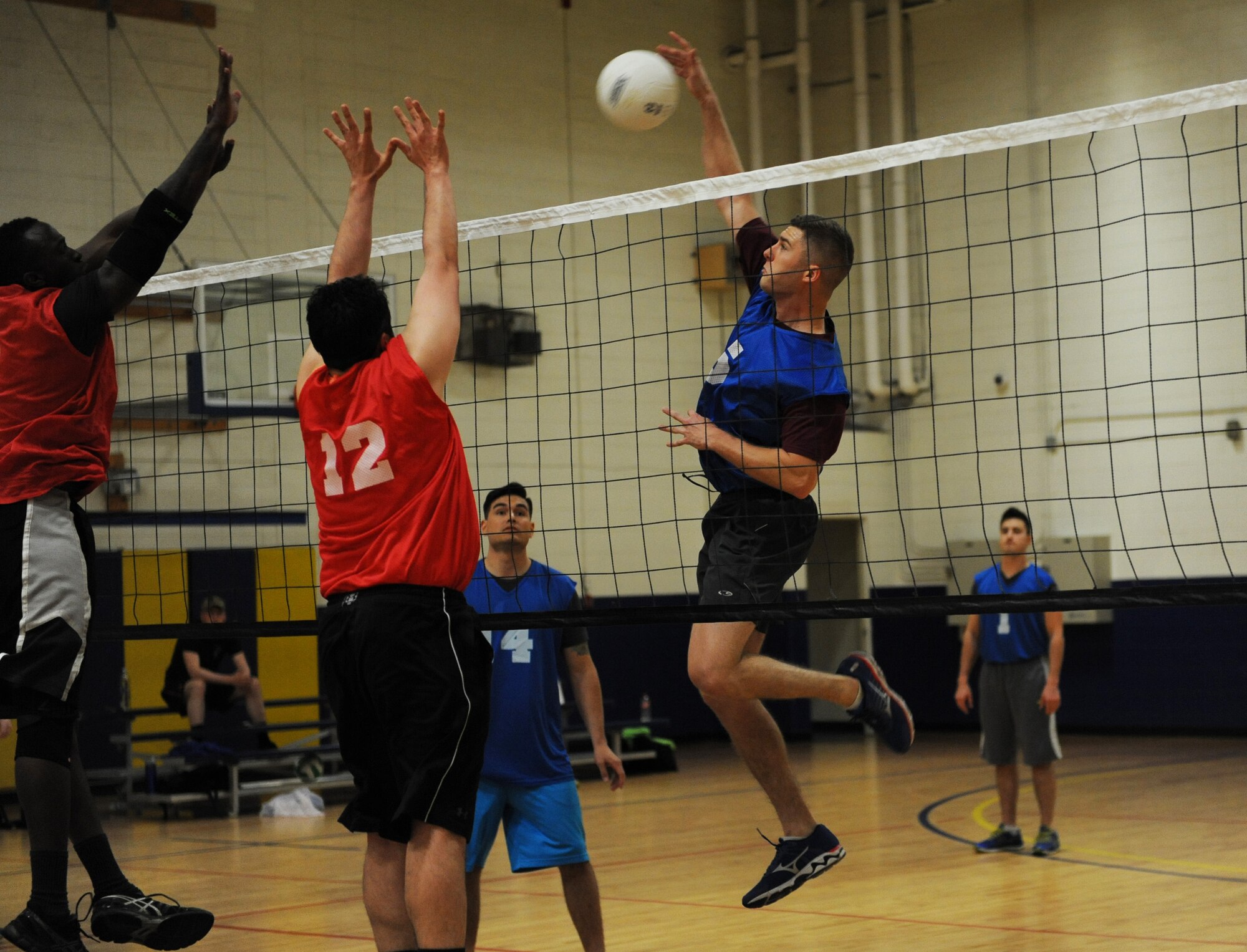 First Lt. Matthew Weiser, 81st Training Support Squadron international military student office officer in charge, spikes the ball during an intramural volleyball game at the Blake Fitness Center March 10, 2016, Keesler Air Force Base, Miss. The 81st TRSS defeated the 81st Aerospace Medicine Squadron, 2-1. (U.S. Air Force photo by Kemberly Groue)