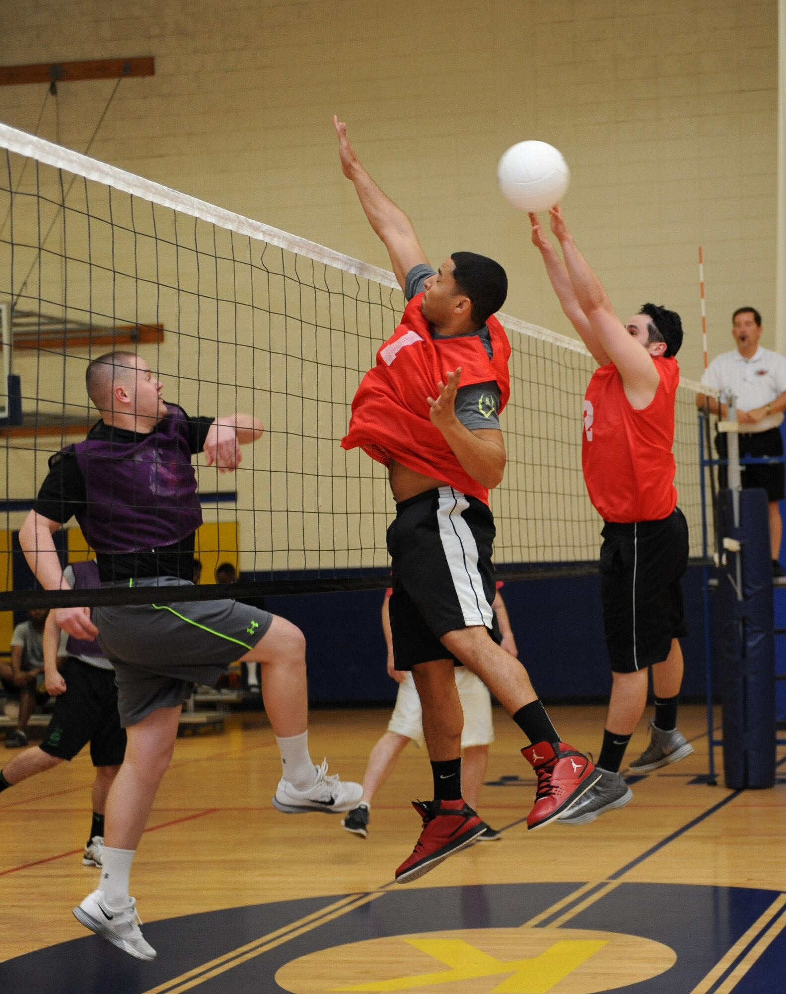 Members of the 81st Aerospace Medicine Squadron and 335th Training Squadron play an intramural volleyball game at the Blake Fitness Center March 10, 2016, Keesler Air Force Base, Miss. The 81st AMDS defeated the 335th TRS, 2-1. (U.S. Air Force photo by Kemberly Groue)