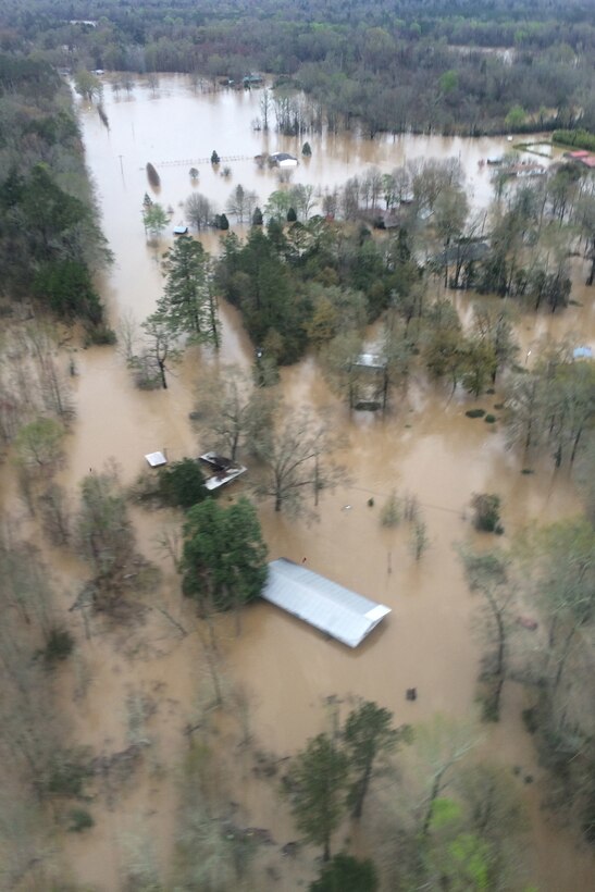Flooding is evident in Franklinton, La., March 11, 2016, as Louisiana Army National Guardsmen conduct aerial reconnaissance of the area. National Guard photo by Sgt. Cody Westmoreland