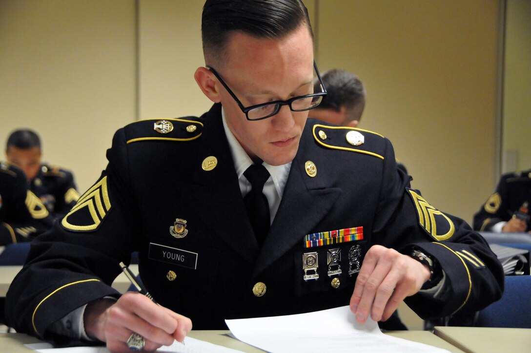 Staff Sgt. Joseph Young, assigned to the U.S. Army Reserve's Army Band at Fort Totten, N.Y., works on an Army general knowledge exam on the second day of the 99th Regional Support Command three-day Best Warrior Competition at Camp Bullis, Texas. Winners will go on to compete in the U.S. Army Reserve Command Best Warrior Competition.