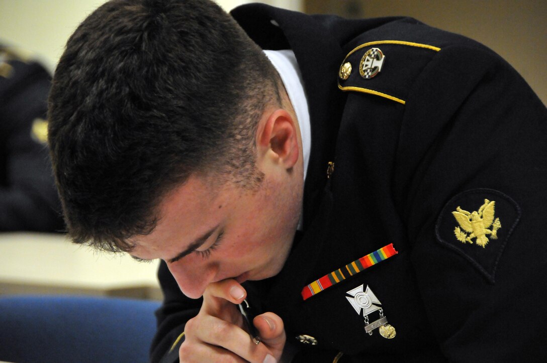 Spc. Connor Walraven, assigned to the U.S. Army Reserve's Army Band at Fort Totten, N.Y., works on an Army general knowledge exam on the second day of the 99th Regional Support Command three-day Best Warrior Competition at Camp Bullis, Texas. Winners will go on to compete in the U.S. Army Reserve Command Best Warrior Competition.