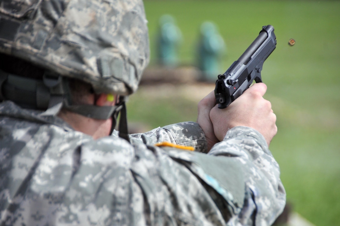 Spc. Connor Walraven, assigned to the U.S. Army Reserve's 319th Army Band at Fort Totten, N.Y., fires an M9 pistol on the third and final day of the 99th Regional Support Command three-day Best Warrior Competition March 10-12 at Camp Bullis, Texas.