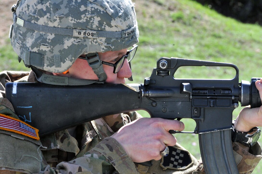 Staff Sgt. Joseph Young, assigned to the U.S. Army Reserve's 319th Army Band at Fort Totten, N.Y., qualifies with an M16A2 rifle on the last day of the 99th Regional Support Command three-day Best Warrior Competition March 10-12 at Camp Bullis, Texas.