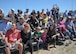 Spectators observe Kent Pietsch operate the Jelly Belly airplane as he performs aerial demonstrations during the Thunder and Lightning over Arizona Open House event at Davis-Monthan Air Force Base, Ariz., March 13, 2016. Pietsch flies the 800-pound Interstate Cadet with a 37-foot wingspan. (U.S. Air Force photo by Airmen 1st Class Ashley N. Steffen/Released)