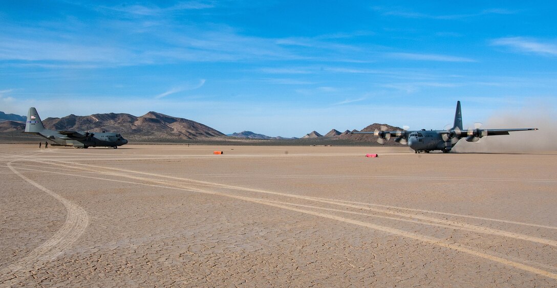 A C-130 Hercules from the 700th Airlift Squadron lands on a dry lake bed near Nellis Air Force Base, Nev. during Red Flag 16-2 March 5, 2016. Red Flag is an exercise hosted by Nellis Air Force Base, Nev. that provides aircrews an opportunity to experience realistic, stressful combat situations in a controlled environment to increase mission capability. (U.S. Air Force photo/Staff Sgt. Daniel Phelps)
