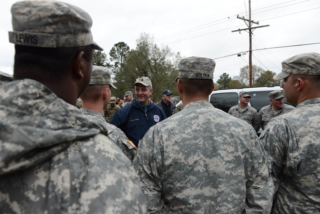 Louisiana Gov. John Bel Edwards talks to Louisiana National Guardsmen supporting flood response operations in Ponchatoula, La., March 12, 2016. Louisiana National Guard photo by Air Force Master Sgt. Toby M. Valadie