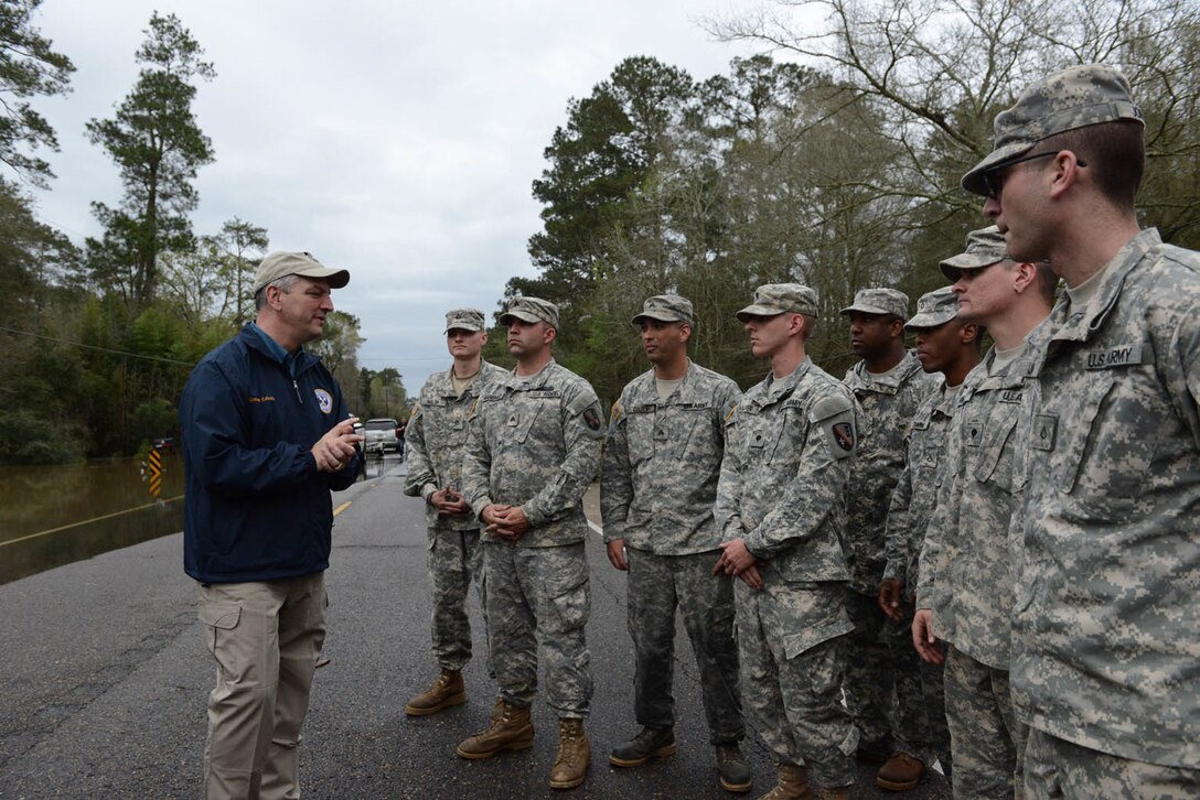 Louisiana Gov. John Bel Edwards talks to Louisiana National Guardsmen and thanks them for their work supporting flood response operations in Ponchatoula, La., March 12, 2016. Louisiana National Guard photo by Air Force Master Sgt. Toby M. Valadie