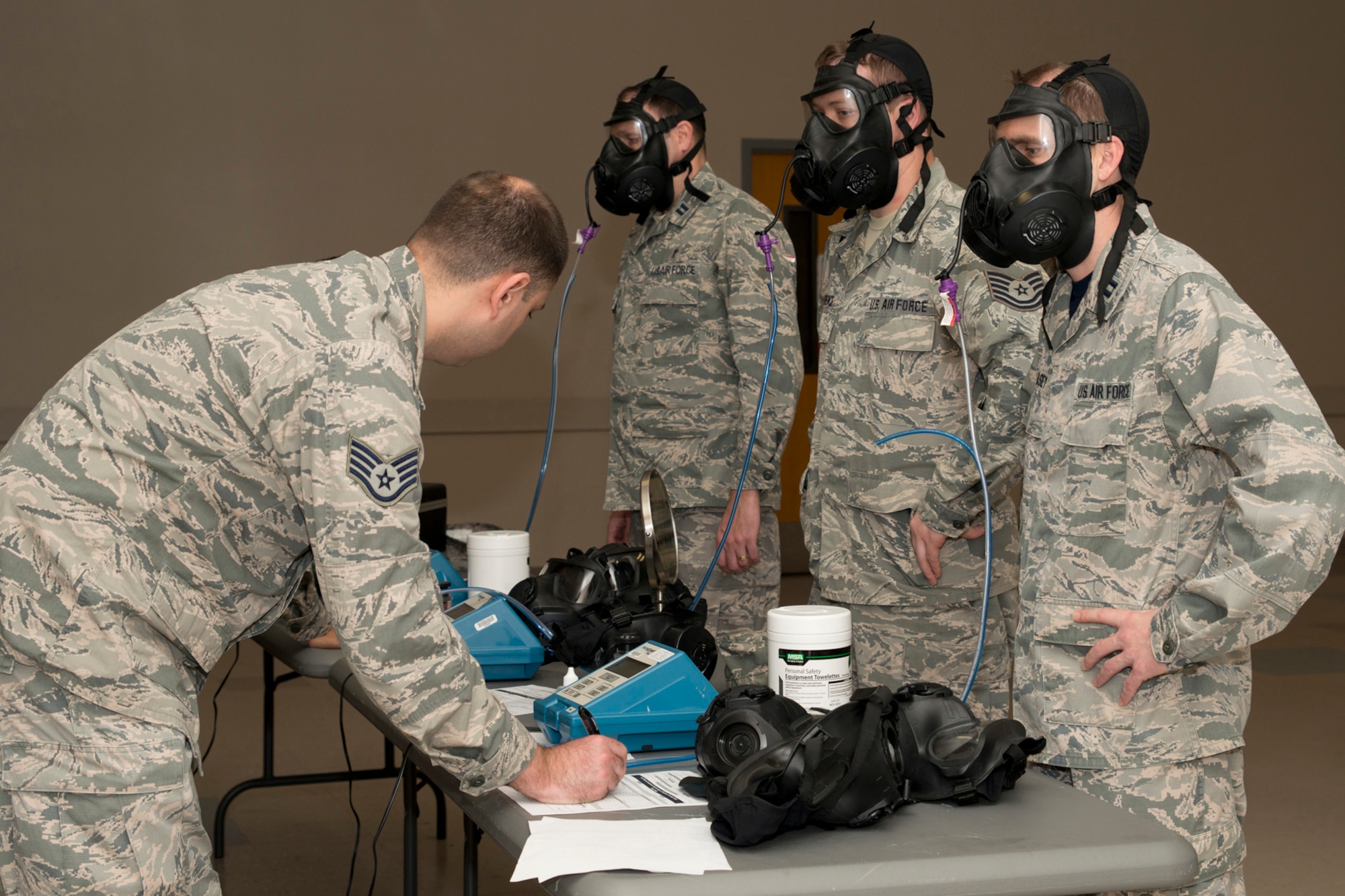 U.S. Air Force Staff Sgt. Kyle Love, 19th Medical Group bioenvironmental technician, conducts gas mask fit tests on Reserve Airmen at Little Rock Air Force Base, Ark., Mar. 13, 2016. The tests, which are mandatory requirements, ensure which size mask will keep each individual safe during situations involving airborne pollutants and toxic gases. (U.S. Air Force photo by Master Sgt. Jeff Walston/Released)