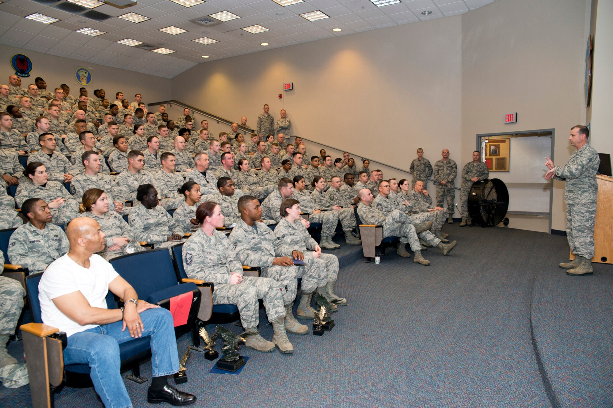 U.S. Air Force Reserve Col. Craig Drescher, commander, 913th Airlift Group, addresses members of the 913th Maintenance and Force Support Squadrons during a Commander’s Call at Little Rock Air Force Base, Ark., Mar. 13, 2016. A commander’s call is a gathering of personnel under that commanding officer, where awards are presented and pertinent information can be disseminated and discussed.  (U.S. Air Force photo by Master Sgt. Jeff Walston/Released)