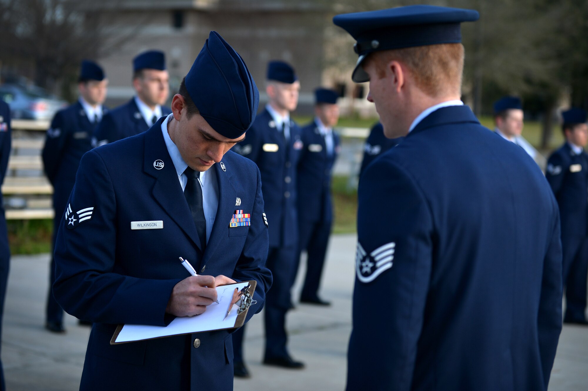 U.S. Air Force Staff Sgt. Jesse Santini, 20th Force Support Squadron Senior Master Sgt. David B. Reid Airman Leadership School instructor, gives uniform critiques to one of his students of ALS Class 16-03 after a uniform inspection at Shaw Air Force Base, S.C., March 10, 2016. Uniform inspections are performed three times throughout each ALS class to ensure student’s uniforms are always serviceable. (U.S. Air Force photo by Senior Airman Michael Cossaboom)
