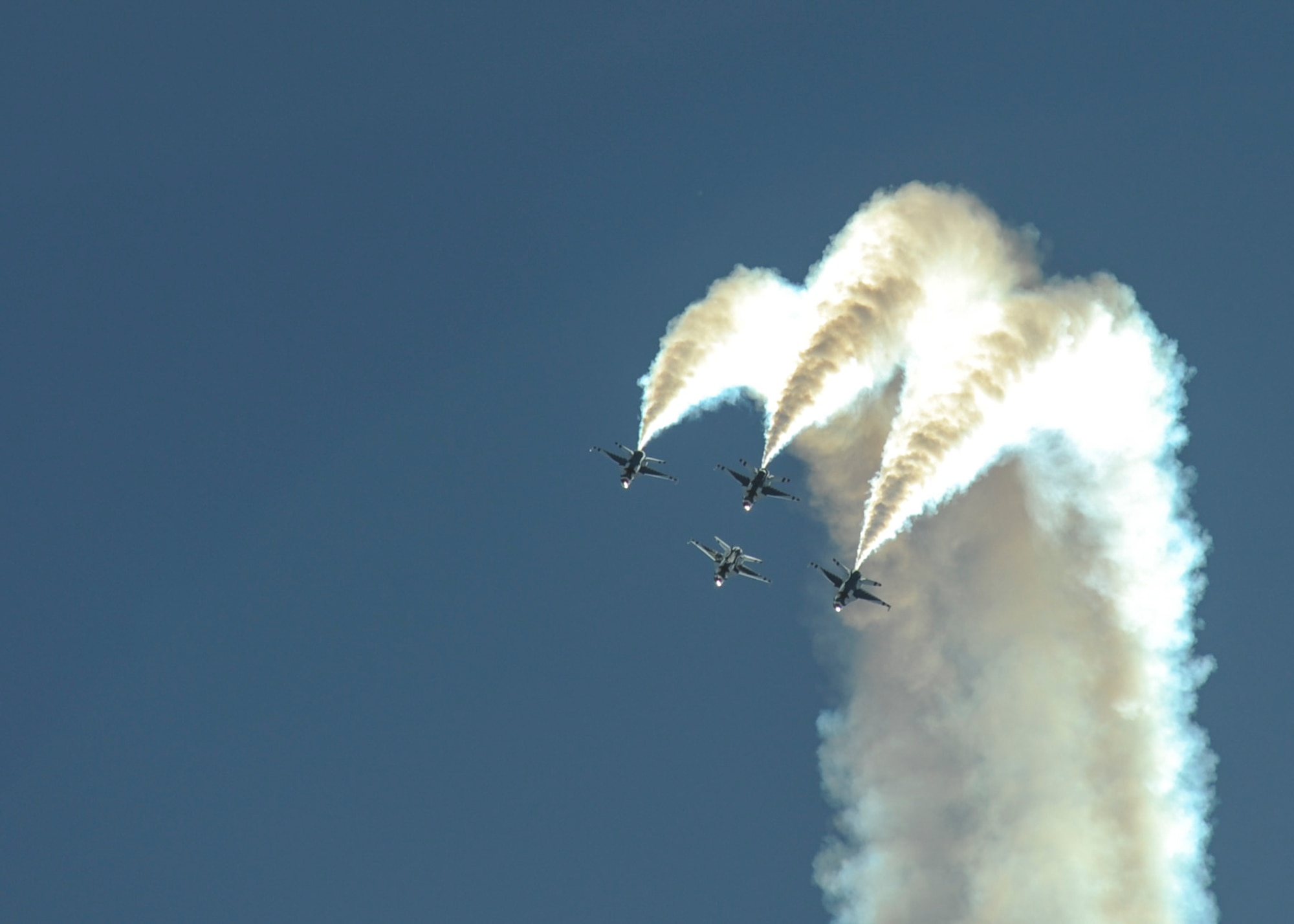 The U.S. Air Force Air Demonstration Squadron, the Thunderbirds, performs aerial maneuvers during the Thunder and Lightning over Arizona Open House at Davis-Monthan Air Force Base, Ariz., March 13, 2016. The aerial demonstrations exhibited some of the maximum capabilities of the F-16 Fighting Falcon, the Air Force’s premier multi-role fighter jet. For each Thunderbirds F-16 aircraft that travels, a crew chief and an assistant crew chief are assigned to it, ensuring their jet is always mission-ready. (U.S. Air Force photo by Airman Nathan H. Barbour/Released)