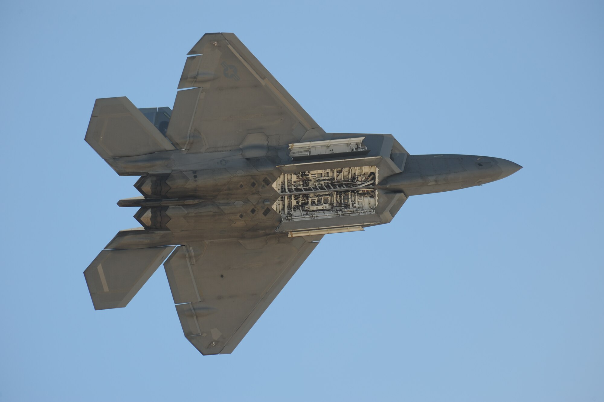 A U.S. Air Force F-22 Raptor displays its weapons bay during the Thunder and Lightning over Arizona Open House at Davis-Monthan Air Force Base, Ariz., March 13, 2016. The Air Force Air Combat Command F-22 Raptor Demonstration Team showed precision aerial maneuvers to demonstrate the unique capabilities of the world's only operational fifth-generation fighter aircraft. (U.S. Air Force photo by Airman Nathan H. Barbour/Released)