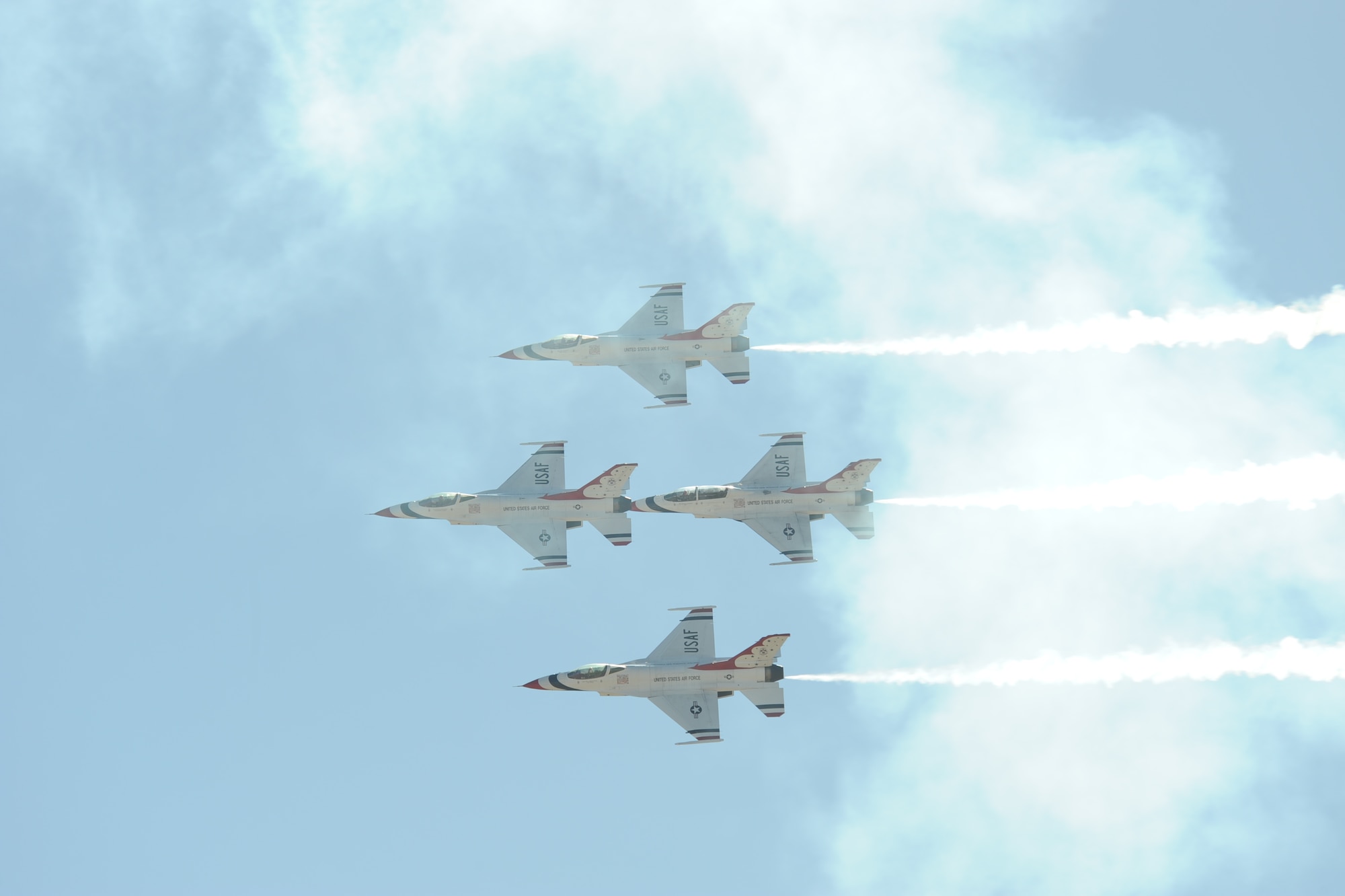 U.S. Air Force Air Demonstration Squadron, the Thunderbirds, flies over Davis-Monthan Air Force Base, Ariz., in a Diamond formation during the Thunder and Lightning over Arizona Open House March 13, 2016. The hour long demonstration gives spectators the chance to witness the precision maneuvers and capabilities the fighter pilots must possess in order to fly the F-16 Fighting Falcon. (U.S. Air Force photo by Airman Nathan H. Barbour/Released)