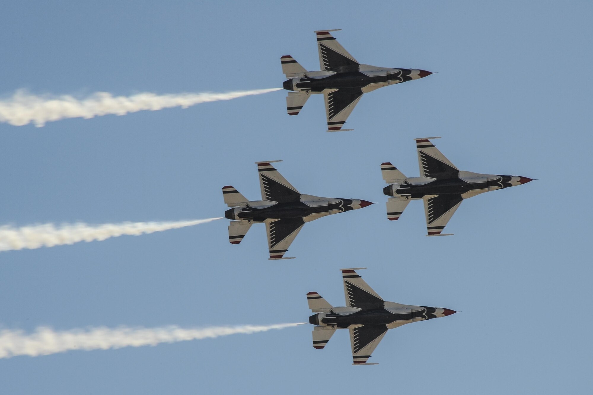 U.S. Air Force Air Demonstration Squadron, the Thunderbirds, flies over Davis-Monthan Air Force Base, Ariz., in a Diamond formation during the Thunder and Lightning over Arizona Open House March 13, 2016. The hour long demonstration gives spectators the chance to witness the precision maneuvers and capabilities the fighter pilots must possess into order to fly the F-16 Fighting Falcon. (U.S. Air Force photo by Airman 1st Class Mya M. Crosby/Released)