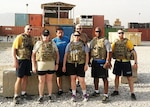 Defense Logistics Agency Aviation Director of Business Process Support, Teresa Smith, first row, second from the left, stands with team members as they prepare for a 10-mile Ruck March on July 28, 2015 at Bagram Airfield, Afghanistan. Smith used the physical resiliency building block to help cope with the stress when she deployed in 2015 as the DLA Support Team Afghanistan deputy commander. 