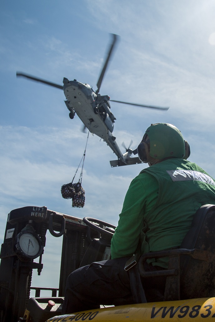 Sailors of the USS New Orleans conduct a resupply at sea with Helicopter Sea Combat Squadron 23 during their Western Pacific Deployment, March 5, 2016. More than 4,500 Marines and Sailors from the Boxer Amphibious Ready Group, 13th Marine Expeditionary Unit team are currently transiting the Pacific Ocean toward the U.S. 7th Fleet area of operations during a scheduled deployment. (U.S. Marine Corps photo by Sgt. Hector de Jesus/Released)