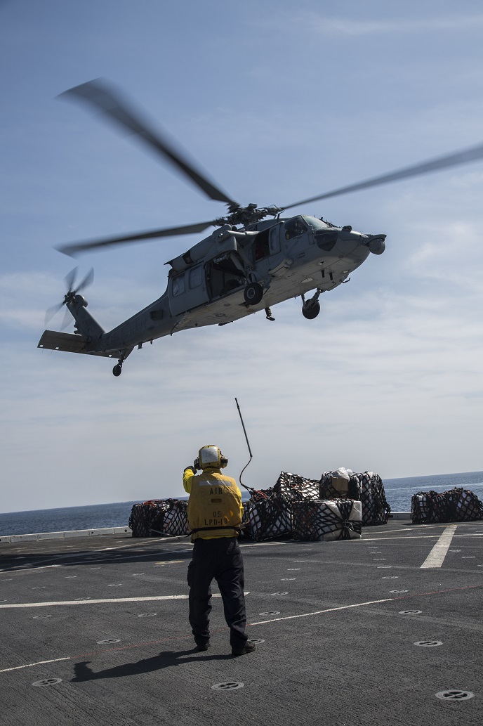 U.S. Navy CH-60 Seahawks with Helicopter Sea Combat Squadron 23 drop off supplies during a resupply at sea aboard the USS New Orleans, Pacific Ocean, March 5, 2016. More than 4,500 Marines and Sailors with the 13th Marine Expeditionary Unit and Boxer Amphibious Ready Group are transiting the Pacific Ocean en route to the Pacific and Central command areas of operations. (U.S. Marine Corps photo by Sgt. Tyler C. Gregory/released)