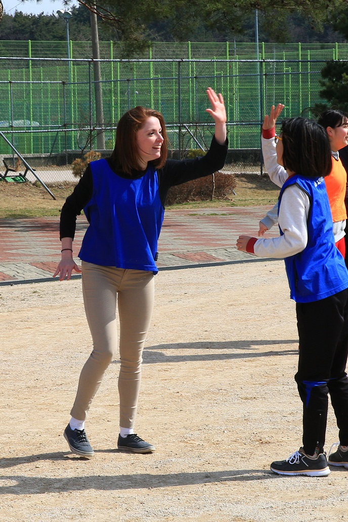 U.S. Marine Cpl. Sara Czipiel, a member of the 13th Marine Expeditionary Unit, high-fives a middle school student from Songra Middle School in Pohang, Korea as they played soccer together March 10, 2016. The soccer game was part of a larger community relations event involving U.S. Marines and Sailors as well as Republic of Korea Marines as the services and nations prepare for Exercise Ssang Yong, a biennial combined amphibious exercise conducted by forward-deployed U.S. forces with the Republic of Korea Navy and Marine Corps, Australian Army and Royal New Zealand Army Forces in order to strengthen our interoperability and working relationships across a wide range of military operations - from disaster relief to complex expeditionary operations. (U. S. Marine Corps photo by Staff Sgt. Terika S. King/Released)