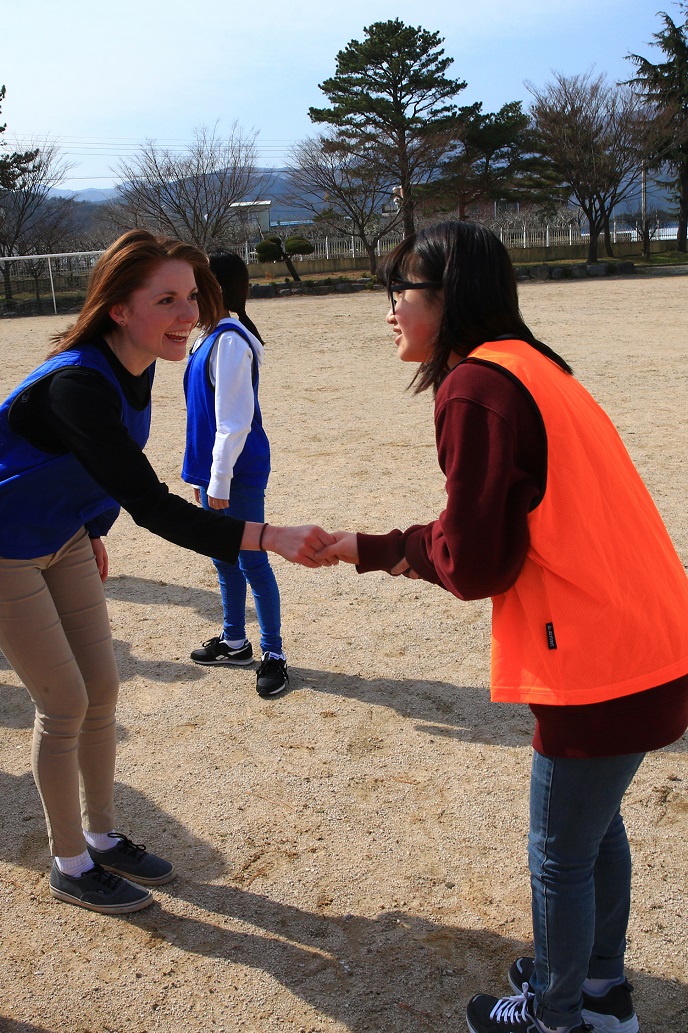 U.S. Marine Cpl. Sara Czipiel, a member of the 13th Marine Expeditionary Unit, shakes hands with a middle school student from Songra Middle School in Pohang, Korea as they played soccer together March 10, 2016. The soccer game was part of a larger community relations event involving U.S. Marines and Sailors as well as Republic of Korea Marines as the services and nations prepare for Exercise Ssang Yong, a biennial combined amphibious exercise conducted by forward-deployed U.S. forces with the Republic of Korea Navy and Marine Corps, Australian Army and Royal New Zealand Army Forces in order to strengthen our interoperability and working relationships across a wide range of military operations - from disaster relief to complex expeditionary operations. (U. S. Marine Corps photo by Staff Sgt. Terika S. King/Released)
