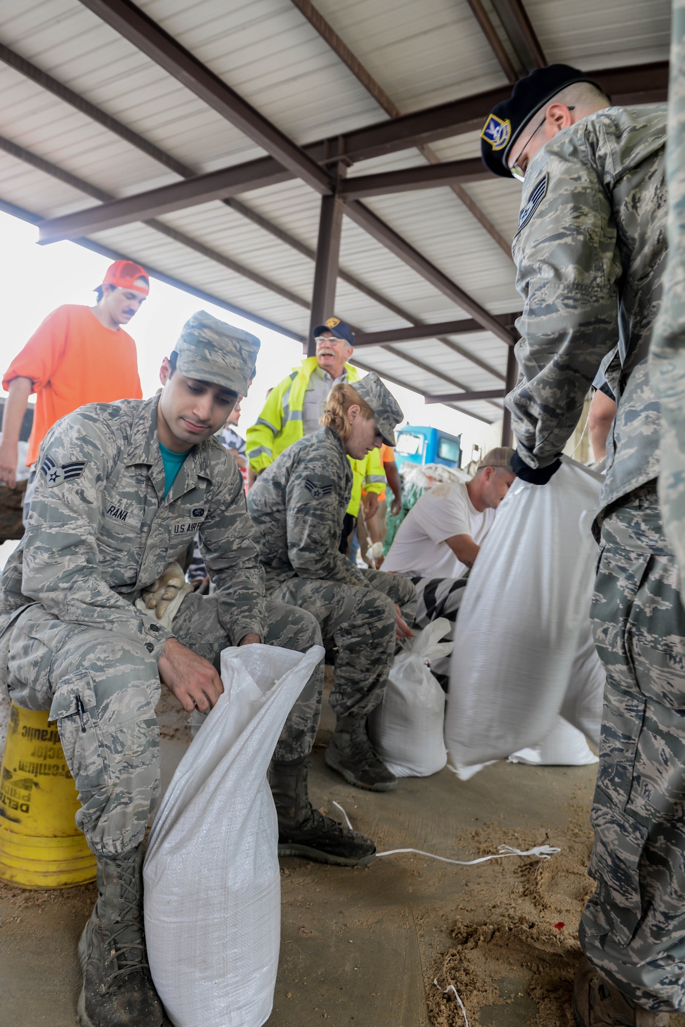 Barksdale Airmen fill sandbags in Bossier City, La., March 11, 2016. The sandbags were both used for infrastructure protection and home protection. The bags were made available to local residents in a variety of locations throughout Bossier City. (U.S. Air Force photo/Senior Airman Mozer O. Da Cunha)