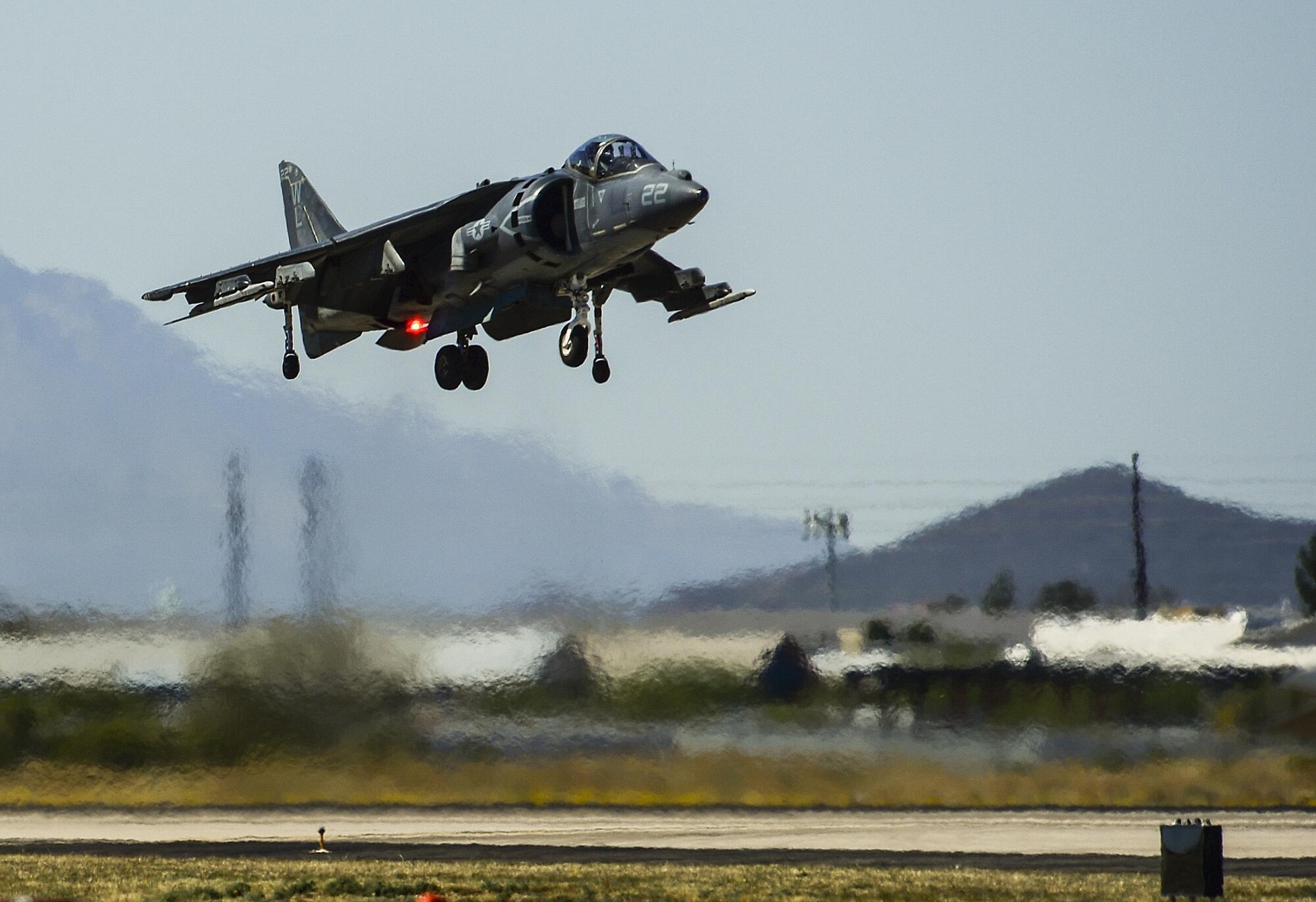 An AV-8B Harrier from Marine Corps Air Station Yuma hovers above the flight line during the Thunder and Lightning over Arizona Open House event at Davis-Monthan Air Force Base, Ariz., March 13, 2016. Some of the Harrier’s combat roles include attacking and destroying surface and air targets, escorting helicopters and engaging in air-to-air defense. (U.S. Air Force photo by Senior Airman Chris Drzazgowski/Released)