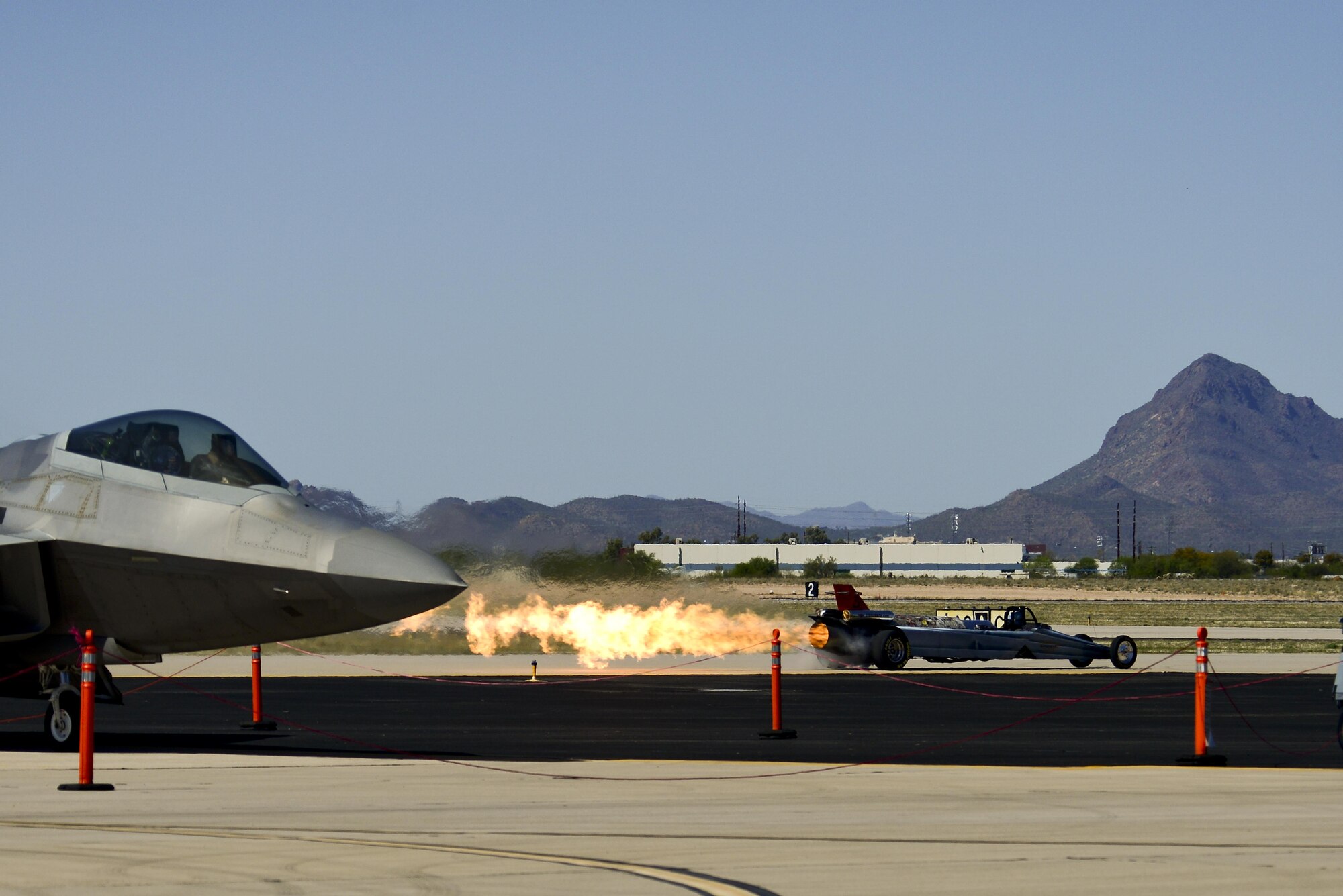 The Smoke-N-Thunder Jet Car engages its afterburner during the Thunder and Lightning over Arizona Open House event at Davis-Monthan Air Force Base, Ariz., March 13, 2016. During its performances, the 10,000 horsepower jet car approaches speeds near 400 mph. (U.S. Air Force photo by Senior Airman Chris Drzazgowski/Released)
