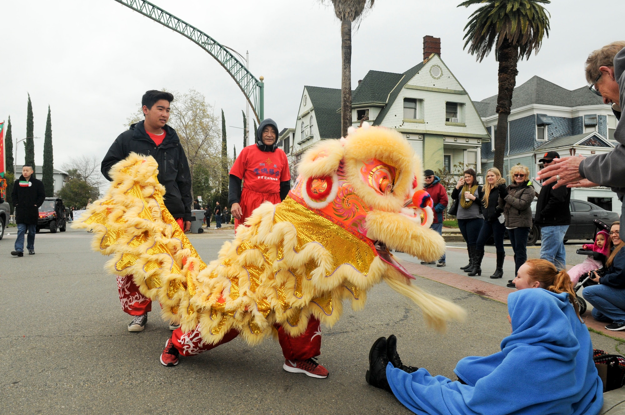San Francisco Lion Dancers interact with Bok Kai Festival patrons in Marysville, California, Mar. 12, 2016. The Bok Kai Festival has been a 136-year tradition for the historic Chinatown in Marysville. The event brought multiple groups from many parts of the world to participate. 