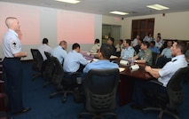 Military logistics and maintenance experts from nine nations gather for a Pacific Agility 16-1 briefing March 14, 2016, at Andersen Air Force Base, Guam. Pacific Agility is a multilateral U.S. Pacific Command-approved engagement focusing on a series of logistics subject-matter expert exchanges led by Pacific Air Forces and designed to increase partner capabilities, military relations and regional stability for the Indo-Asia-Pacific region. (U.S. Air Force photo/Airman 1st Class Arielle Vasquez)