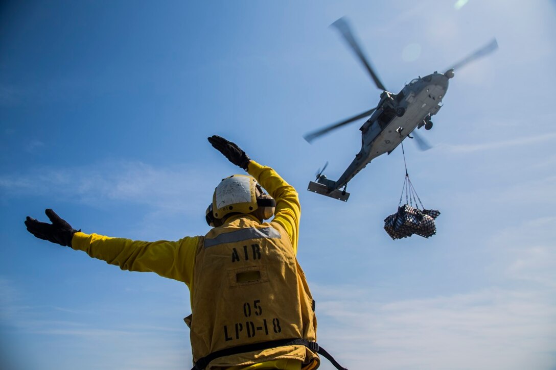 U.S. Navy CH-60 Seahawks with Helicopter Sea Combat Squadron 23 drop off supplies during a resupply at sea aboard the USS New Orleans, Pacific Ocean, March 5, 2016. More than 4,500 Marines and sailors with the 13th Marine Expeditionary Unit and Boxer Amphibious Ready Group are transiting the Pacific Ocean en route to the Pacific and Central command areas of operations. 