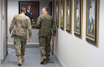 Marine Corps Gen. Joseph F. Dunford Jr., chairman of the Joint Chiefs of Staff, right, and Army Gen. Joseph L. Votel, commander of U.S. Special Operations Command, walk down the "commander's corridor" at Socom headquarters on MacDill Air Force Base, Fla., March 11, 2016. DoD photo by Navy Petty Officer 2nd Class Dominique A. Pineiro