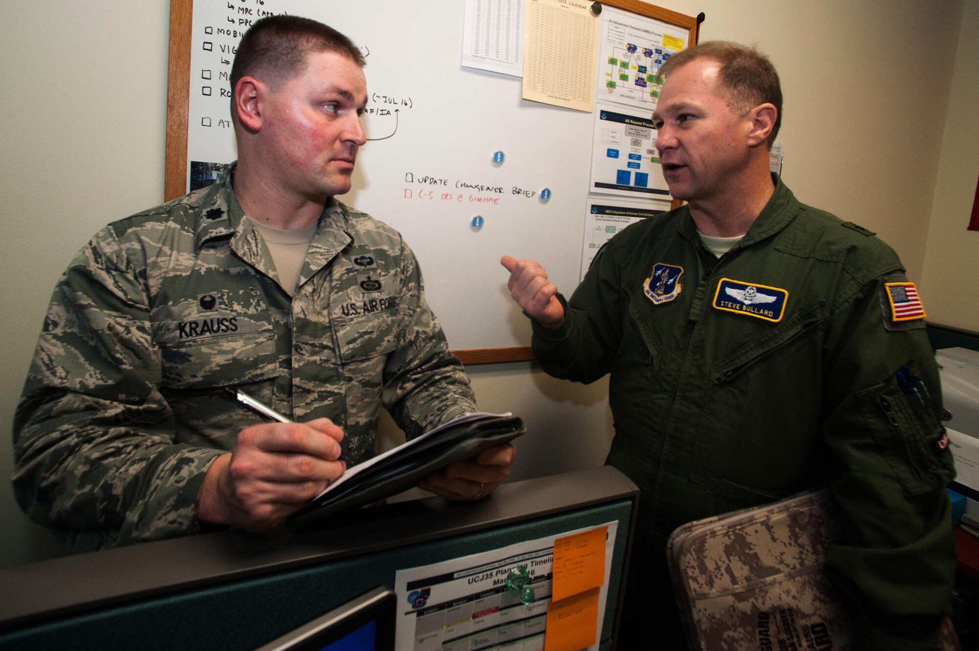 Lt. Col. Kevin Krauss, 607th Air Mobility Division assistant director of mobility forces, takes notes as Brig. Gen. Steven Bullard, 607th AMD director of mobility forces, discusses potential airlift operations during Key Resolve 16 at Osan Air Base, Republic of Korea, March 8, 2016. When the 607th AMD reviews airlift options, there are several safety precautions that must be evaluated before making a decision. (U.S. Air Force photo by Staff Sgt. Nick Wilson/Released)