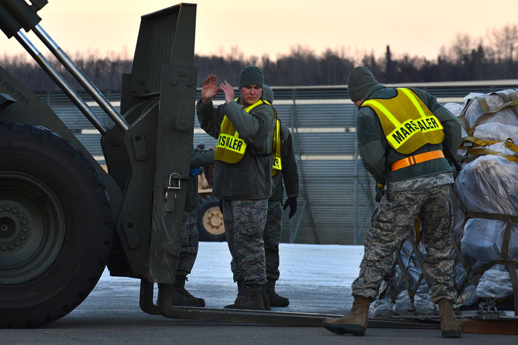 773d Logistics Readiness Squadron members prepare cargo pallets for the Mission Support Group to process as part of the MSG’s annual mobility exercise March 10 at the Joint Mobility Center. In addition to cargo, the 773d LRS processed people for the first time for this exercise. (U.S. Air Force photo by Airman 1st Class Kyle Johnson)