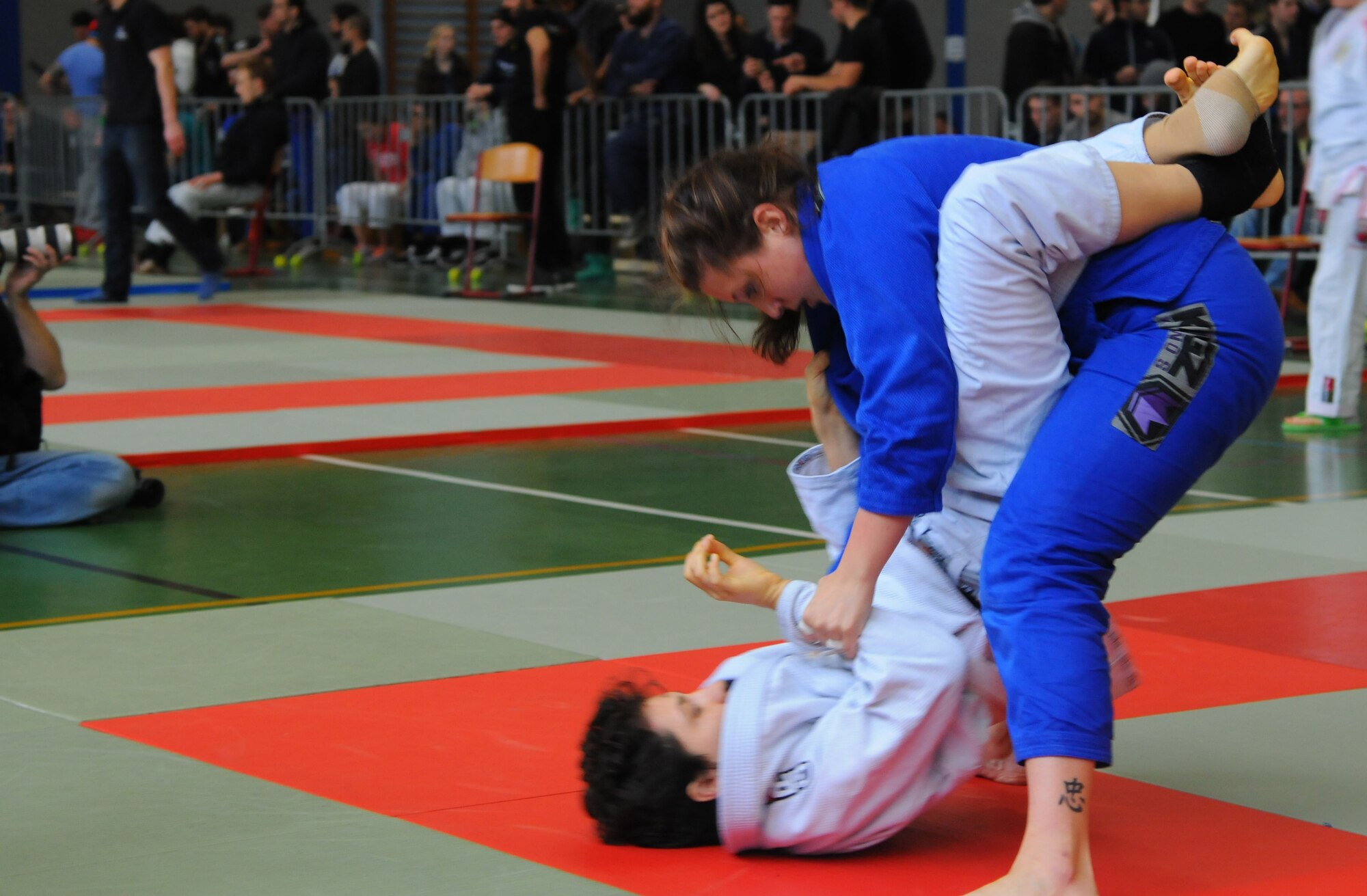 Mariah Johnson, a 52nd Force Support Squadron value-added tax officer and Spangdahlem Brazilian Jiu Jitsu member, right, grapples during her first match at the Submissao competition in Karlsruhe, Germany, Feb. 20, 2016. Johnson lost to her opponent, but received a belt promotion after the match for taking the step to compete. (Courtesy photo)