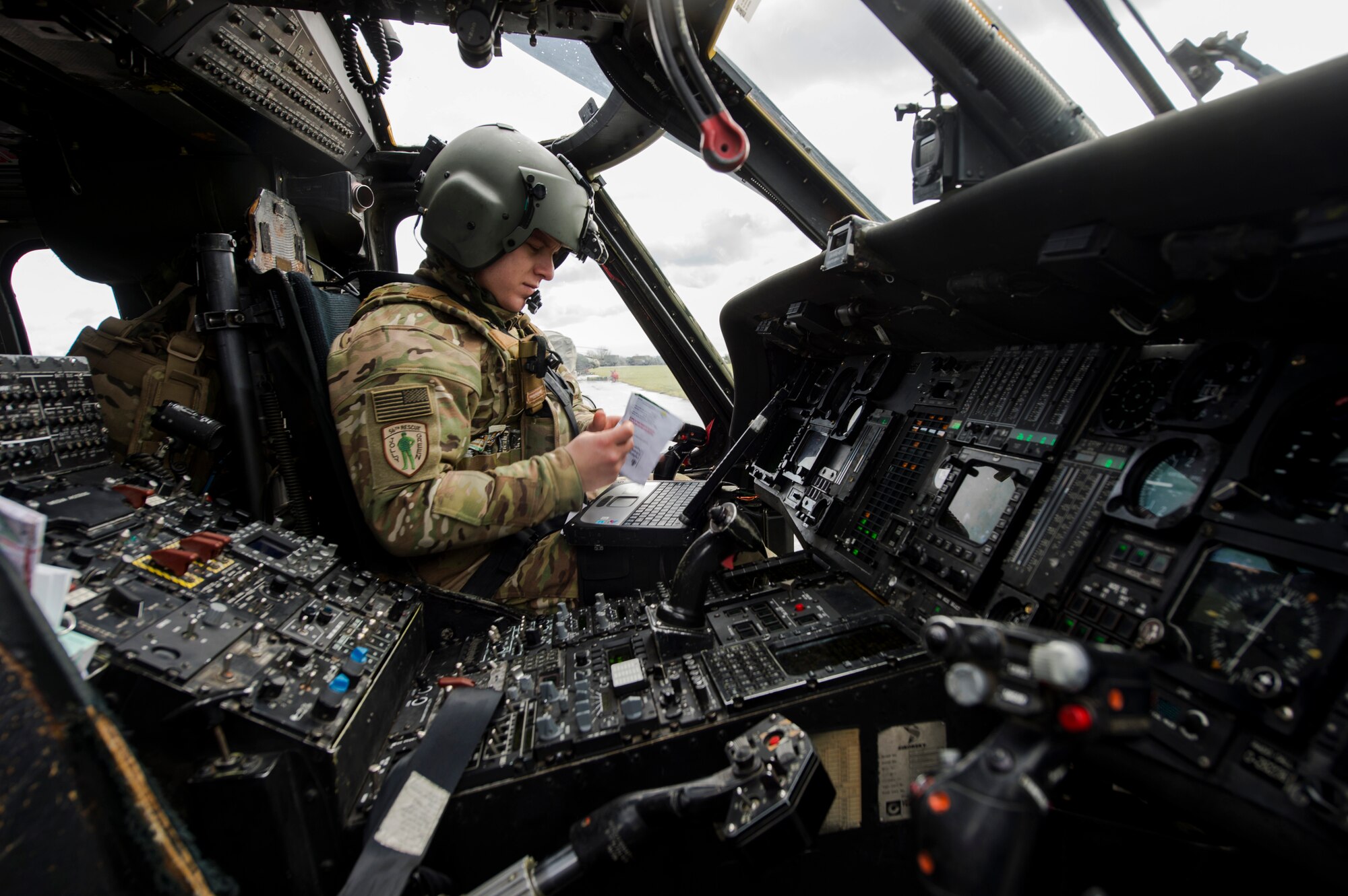 1st Lt. Andrej Pulver, 56th Rescue Squadron co-pilot, performs a pre-flight check during exercise Voijek Valour at Hullavington Airfield, England, March 2, 2016. The 56th RQS provides humanitarian assistance, non-combatant evacuation and disaster relief capability for the U.S. European Command combatant commander and the Joint Chiefs of Staff in peacetime. (U.S. Air Force photo/Staff Sgt. Emerson Nuñez)


