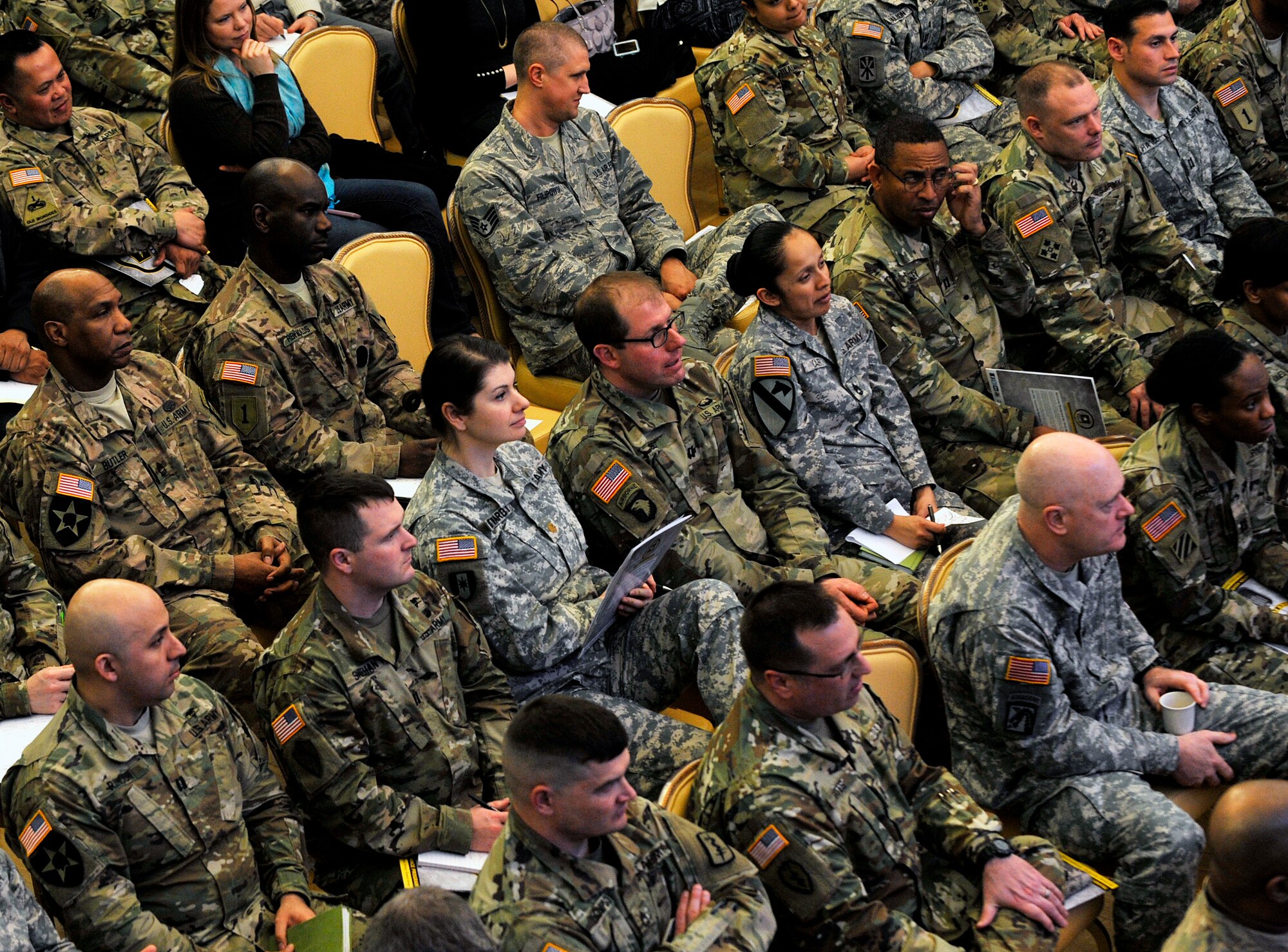 Airmen, Soldiers and spouses listen to a key speaker during a Hiring Our Heroes Kaiserslautern Military Community Transition Summit March 10, 2016, at Vogelweh Military Complex, Germany. Hiring Our Heroes is a nationwide U.S. Chamber of Commerce foundation to help transitioning military members and their spouses find jobs and opportunities after their service commitments. (U.S. Air Force photo/Airman 1st Class Larissa Greatwood)