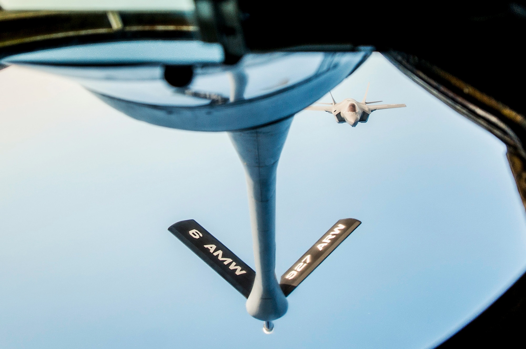 An F-35A Lightning II approaches a KC-135 Stratotanker during a refuel mission over the Gulf of Mexico near Eglin Air Force Base, Fla. March 4.  During the morning mission, local media and 33rd Fighter Wing F-35 maintainers watched as the MacDill Air Force Base KC-135 crew offloaded approximately 48,100 pounds of jet fuel to seven F-35As.  (U.S. Air Force photo/Ilka Cole)
