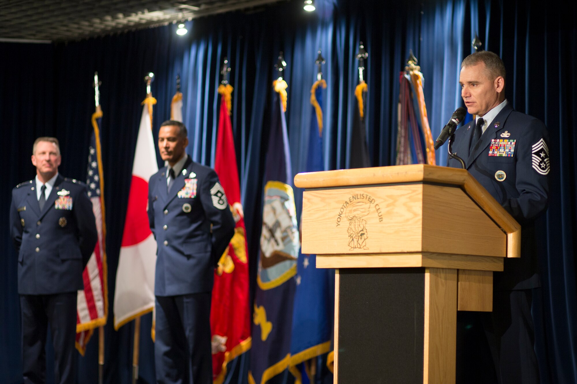 (Right) Chief Master Sgt. James Laurent, United States Forces Japan and 5th Air Force outgoing command chief, gives recognition and thanks to personnel and staff during a change of responsibility ceremony at Yokota Air Base, Japan, March 10, 2016.  Lt. Gen. John Dolan, USFJ and 5th AF commander, presided over the ceremony. (U.S. Air Force photo by Osakabe Yasuo/Released) 