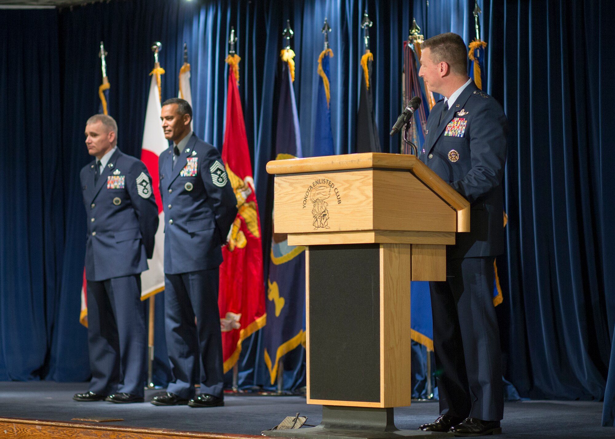 (Right) Lt. Gen. John Dolan, United States Forces Japan and 5th Air Force commander, gives a speech during a change of responsibility ceremony at Yokota Air Base, Japan, March 10, 2016. Dolan presided over the ceremony. (U.S. Air Force photo by Osakabe Yasuo/Released)