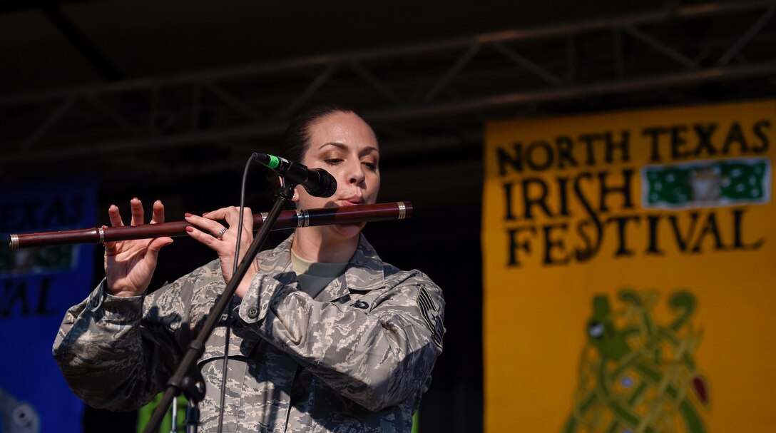 Tech. Sgt. Julia Cuevas, United States Air Force Band’s Celtic Aire vocalist, plays an Irish flute during a Celtic Aire performance at the North Texas Irish Festival in Dallas, Texas, March 5, 2016. The band is the premier Celtic and folk ensemble of the U.S. Air Force Band. (U.S. Air Force photo by Senior Airman Ryan J. Sonnier/RELEASED)