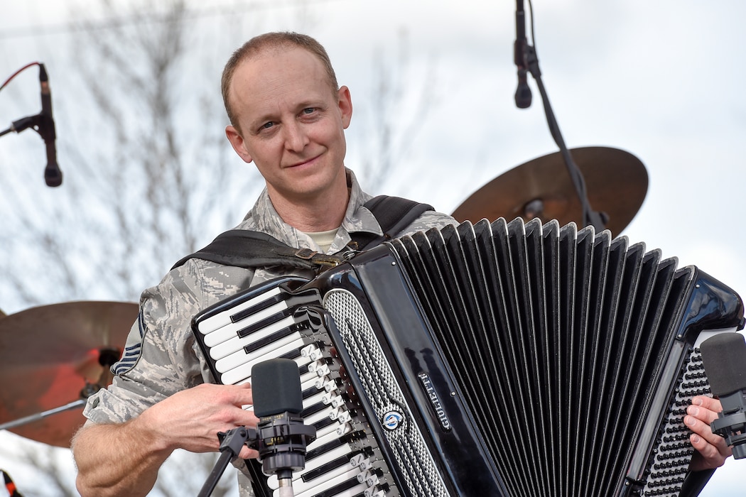 Senior Master Sgt. Dennis Hoffmann, United States Air Force Band’s Celtic Aire percussionist, plays an accordion during a performance at the Wichita Falls Irish Street Festival in Wichita Falls, Texas, March 12, 2016. The band is the premier Celtic and folk ensemble of the U.S. Air Force Band. (U.S. Air Force photo by Senior Airman Ryan J. Sonnier/RELEASED)